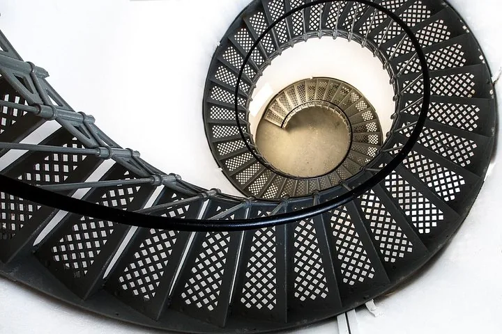 Looking down the spiralling metal staircase inside the Cape Bruny Lighthouse.